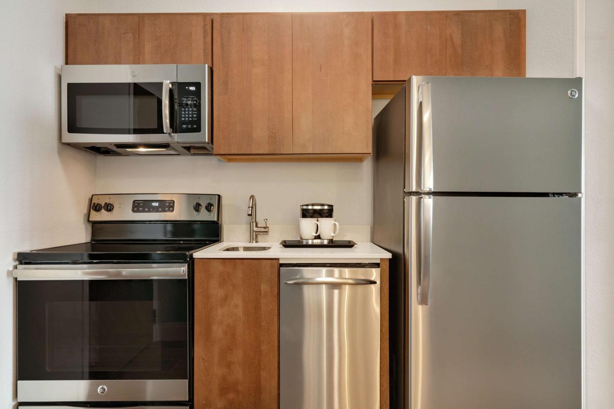 Queen Room Two Queen Beds Kitchen Partial Ocean View